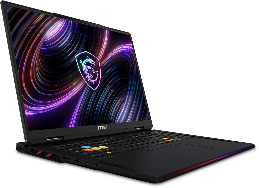 MSI Raider 18 Max HX A2WI-1048RU открытый вид спереди с RGB-подсветкой клавиатуры и демонстрационным изображением на экране