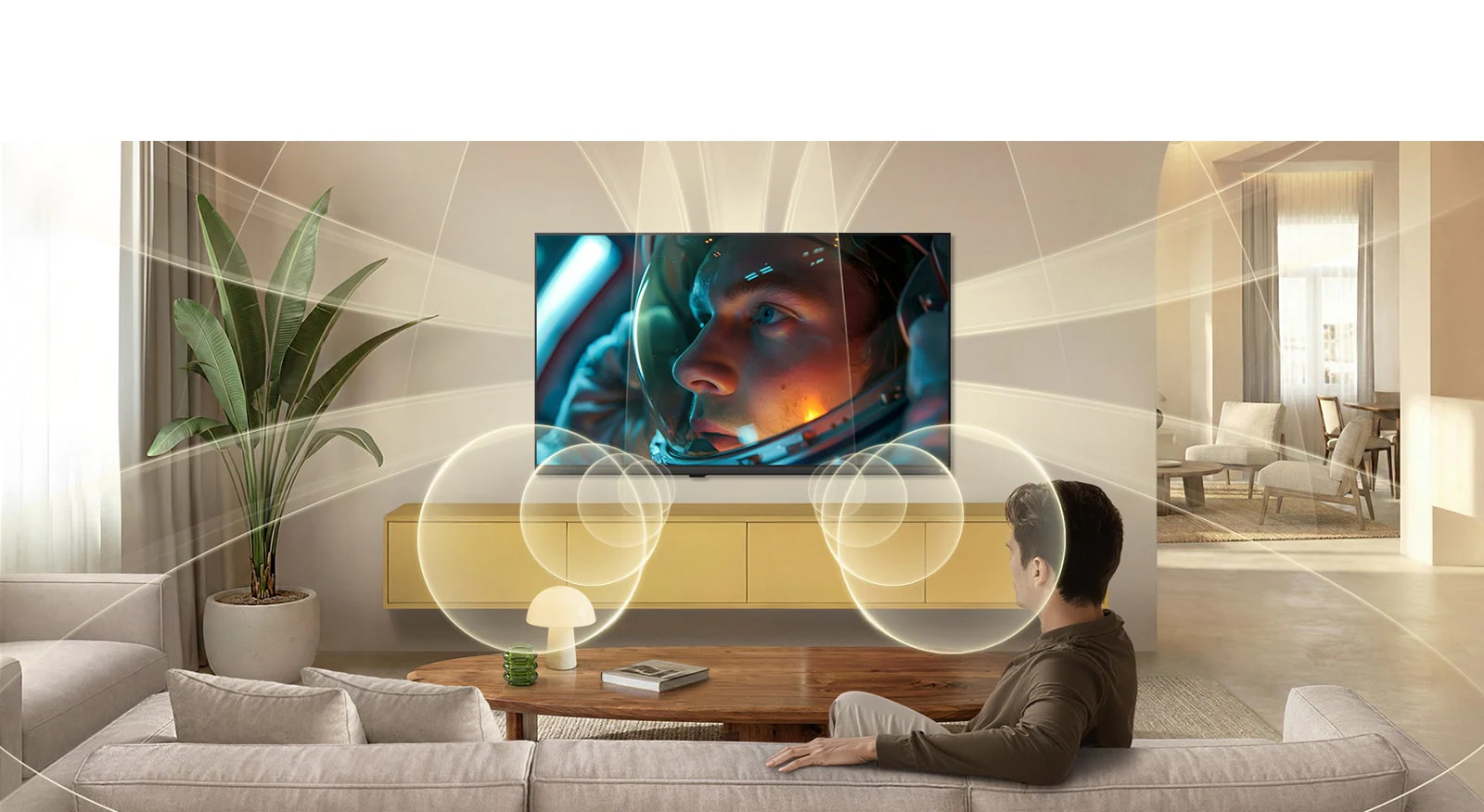 LG 24LB70006LA в интерьере гостиной с визуализацией объёмного звука — телевизор и система динамиков
