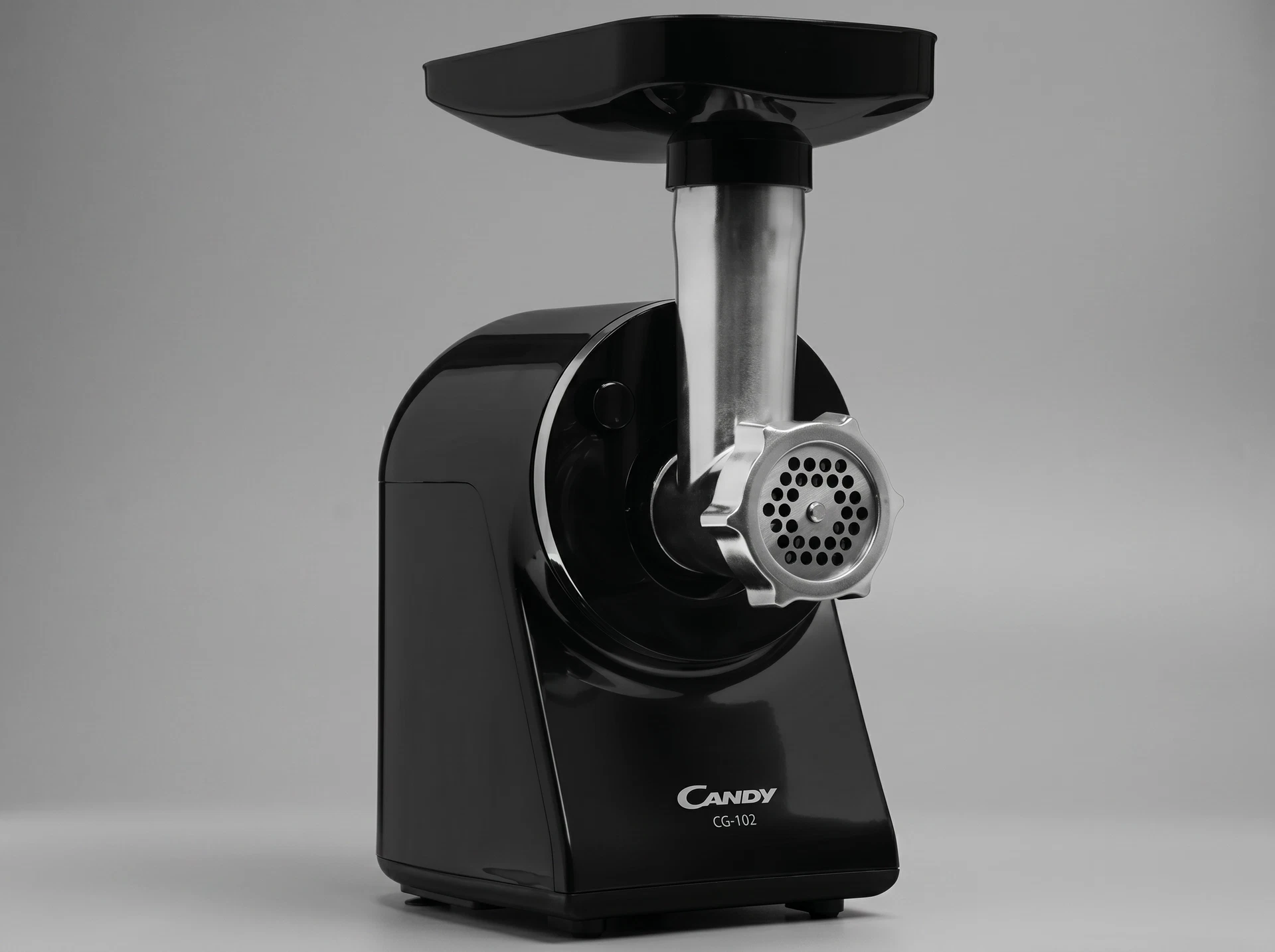 Candy CG-102 крупный план — металлический лоток и чёрный пластиковый корпус